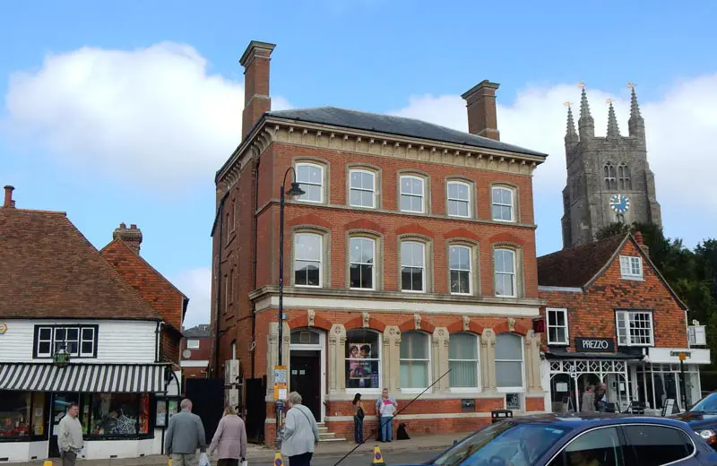 Old town building with white sliding sash windows