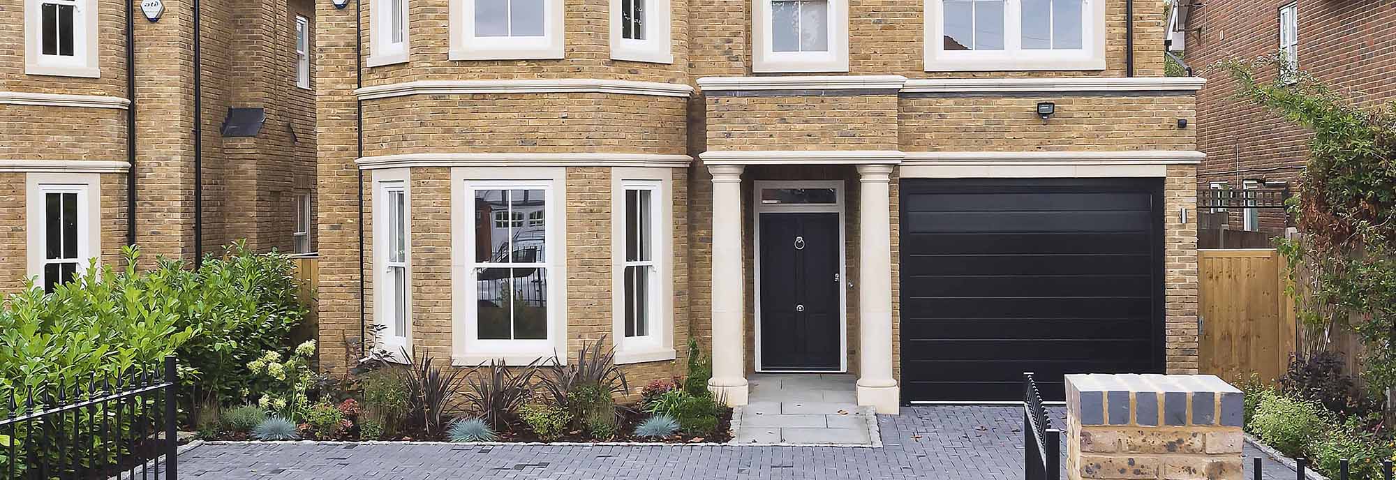 Black entrance door and white windows