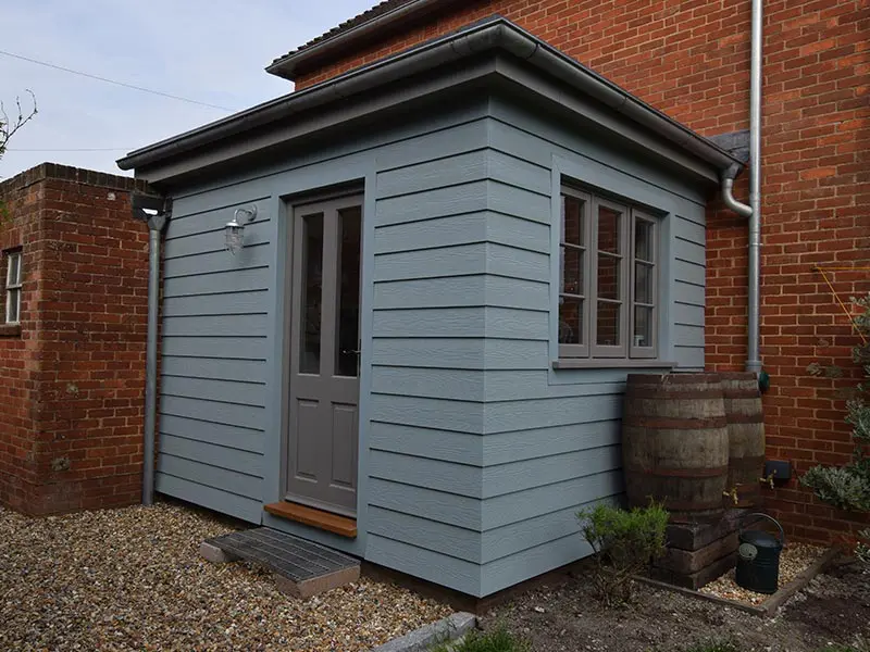 Porch area with grey entrance door