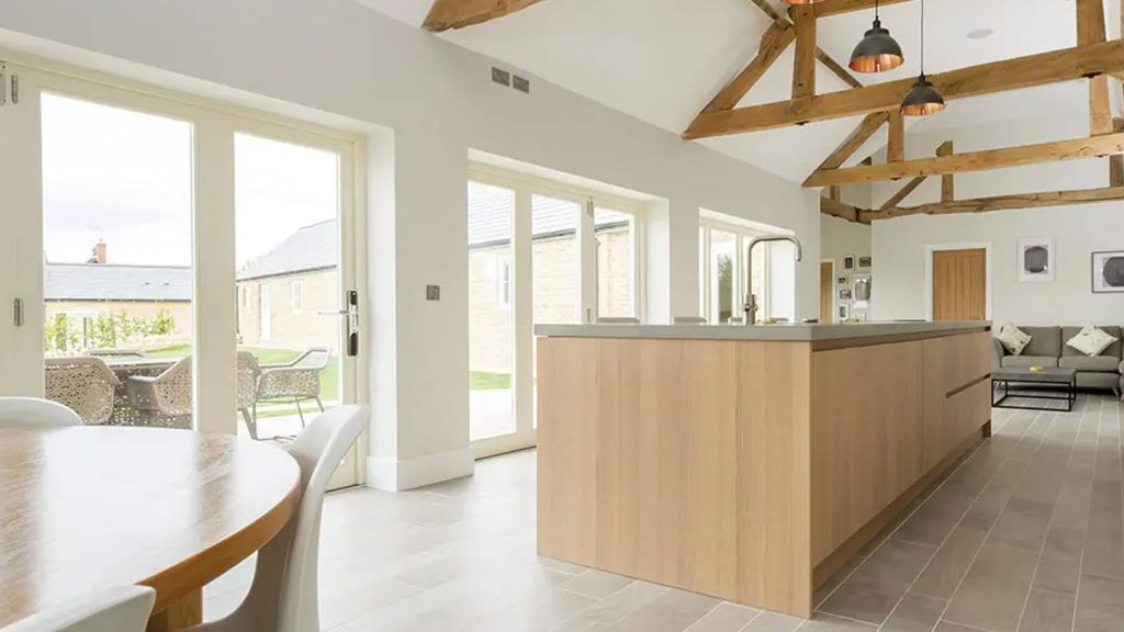 Sleek kitchen with white bifold doors