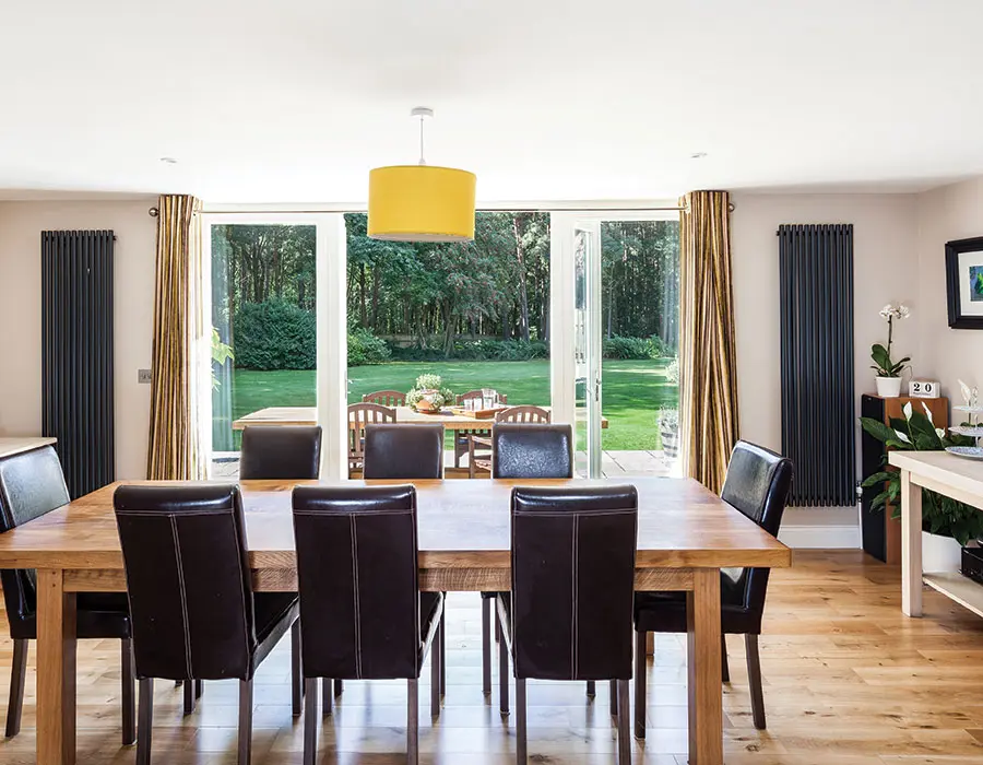 Dining area with French doors opened to garden