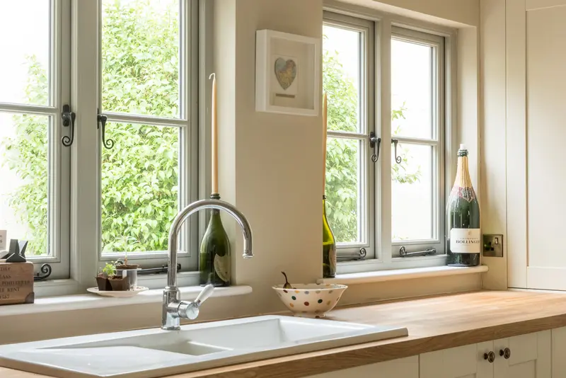 kitchen with flush casement windows monkey tail handle