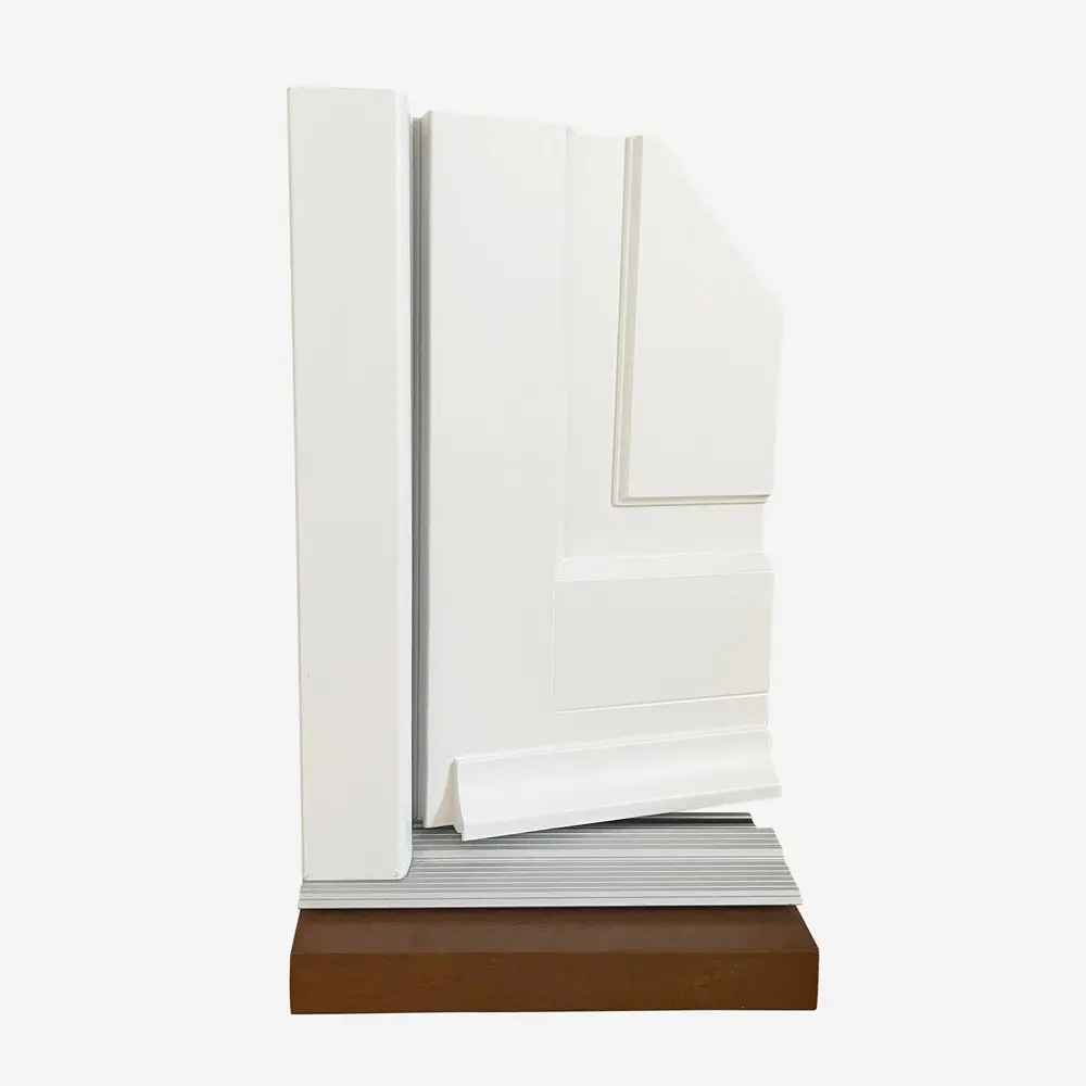 A corner sample of a white traditional entrance door