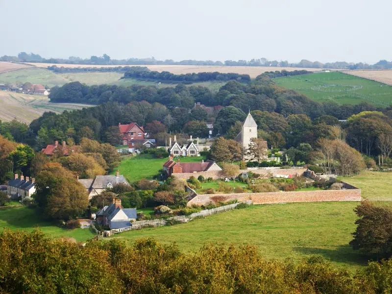 View of the countryside with a church and houses