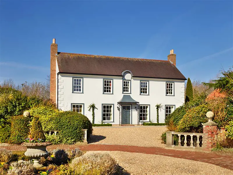 Large white house with sliding sash windows