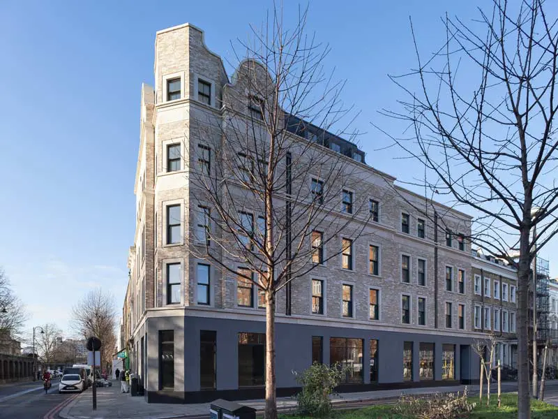 Residential building on city street with sliding sash windows