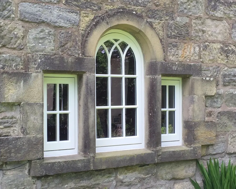 Arched flush casements with bars