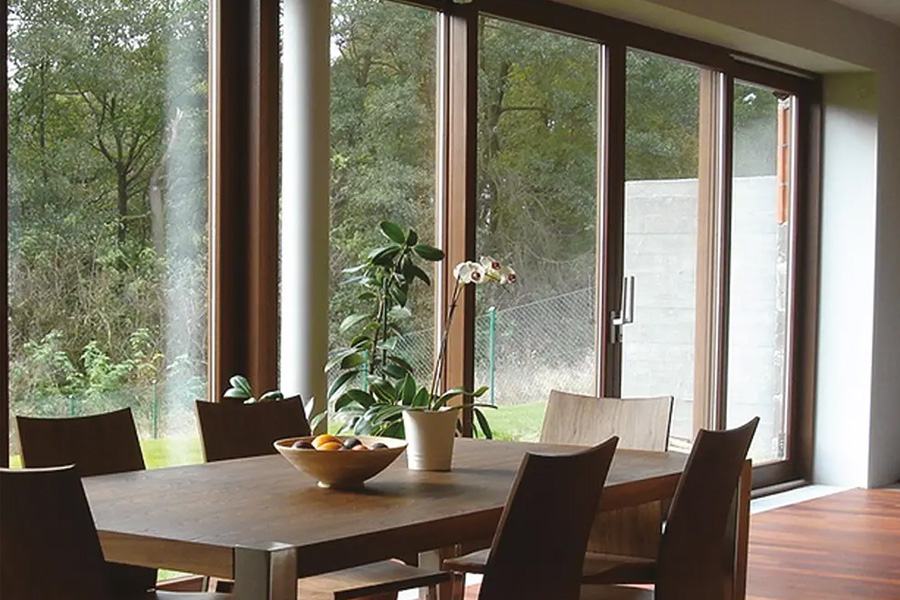 Dining area with brown bifold doors