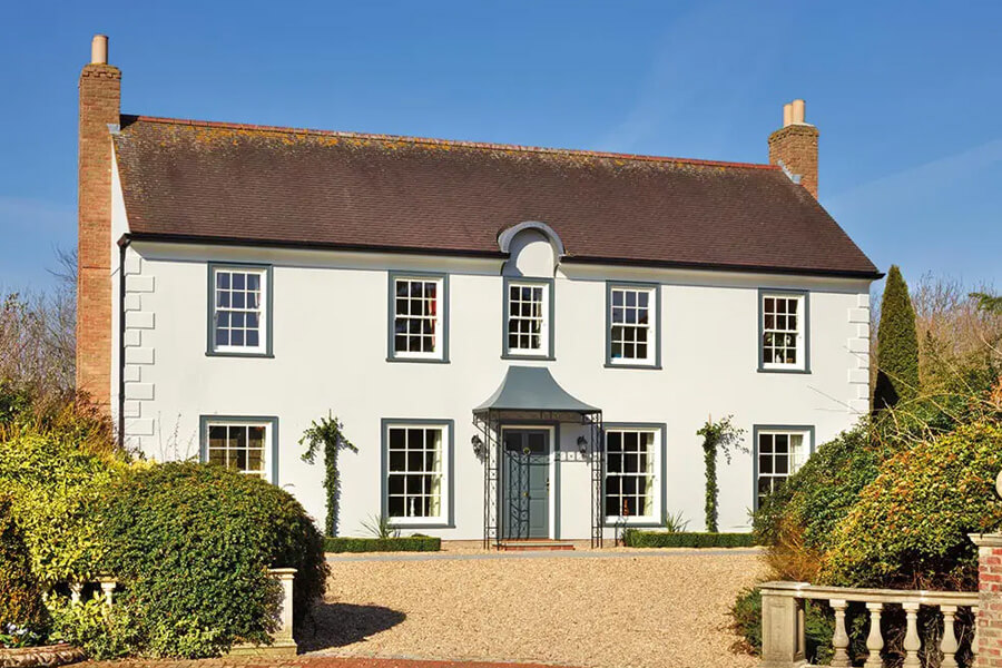 White house with sliding sash windows