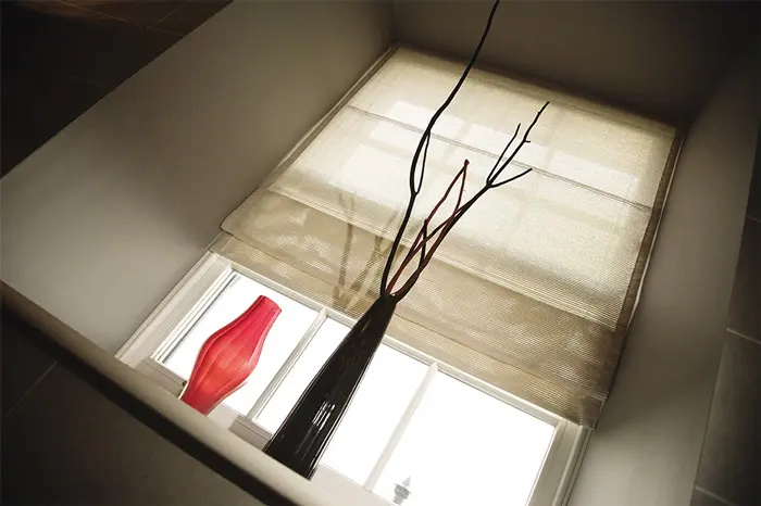 Close up of a window with the blind down