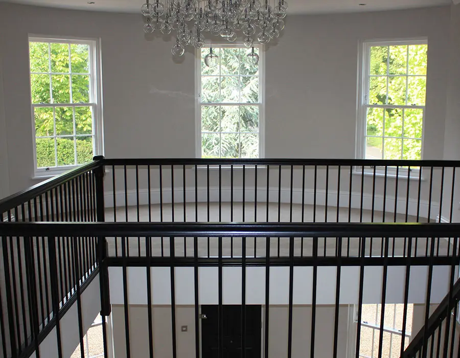 Landing area in a house with white sliding sash windows