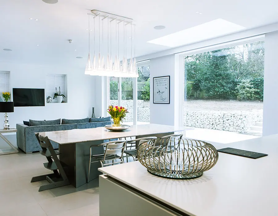 Slick kitchen with a large window and bi-fold doors