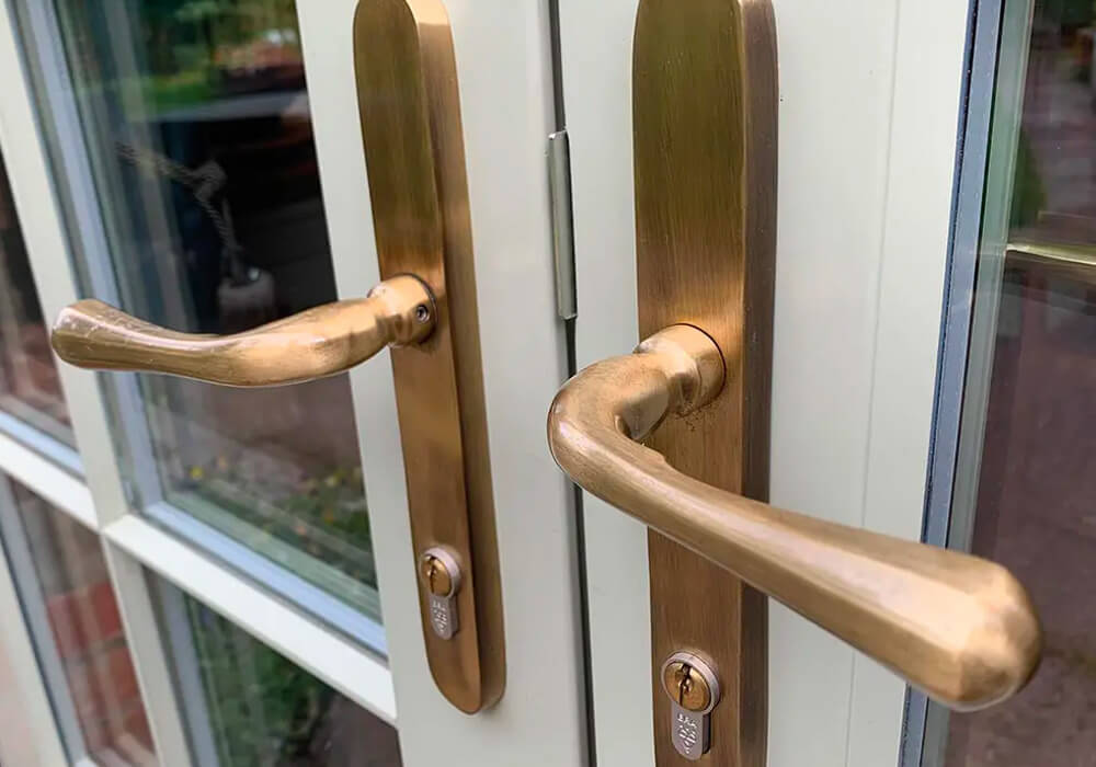 Close up of a French door with bronze handles