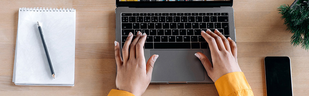 Person typing on laptop