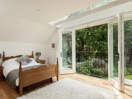Bedroom French Doors Open to Forest