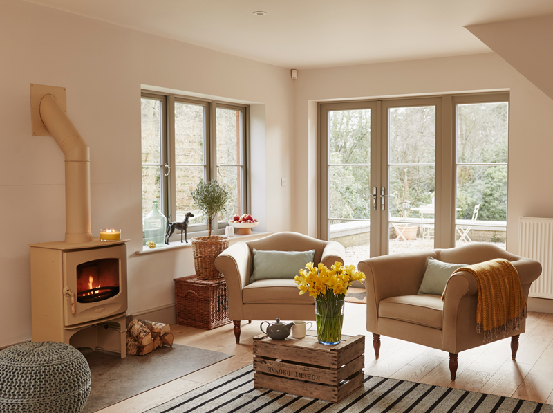 Living Room with log burner and french doors casement windows