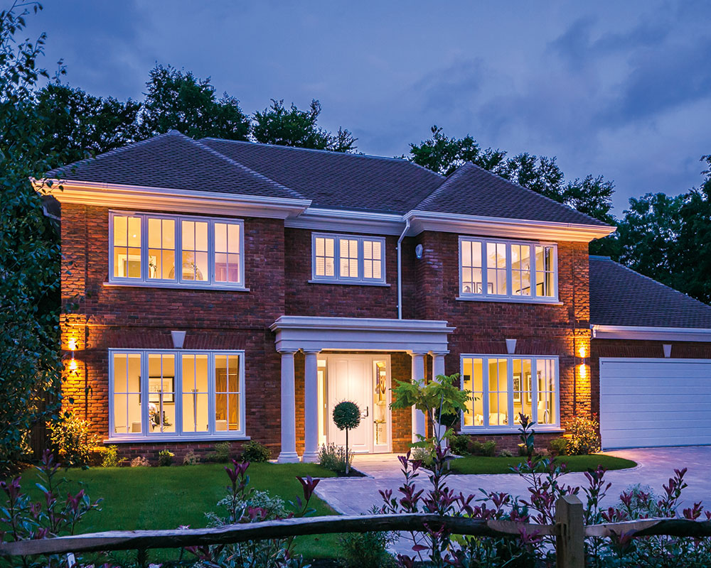 casement windows lit up at night