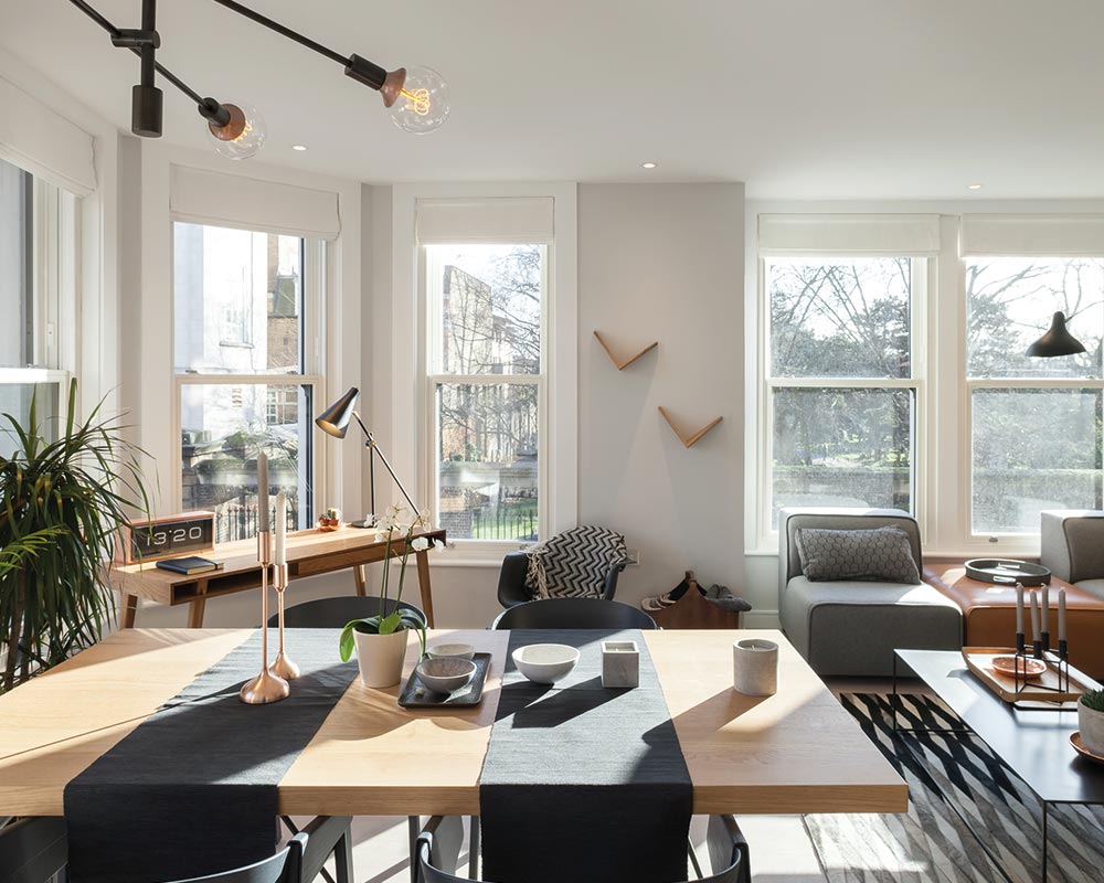 Interior of a modern home living room with white sliding sash windows