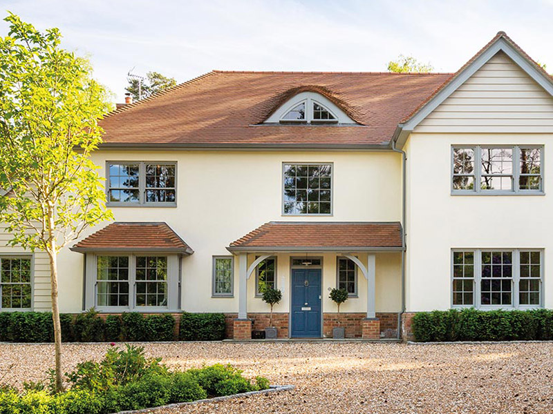 External image of a house with grey timber sliding sash windows