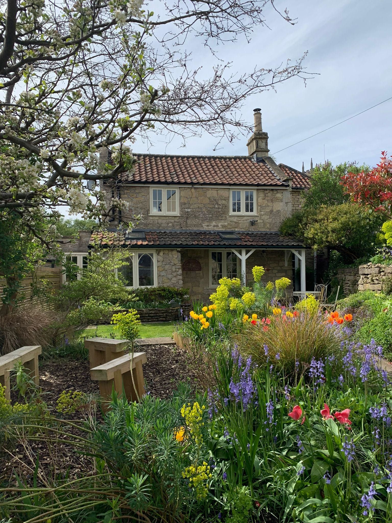 Exterior view of brick Countryside cottage featuring timber casement windows