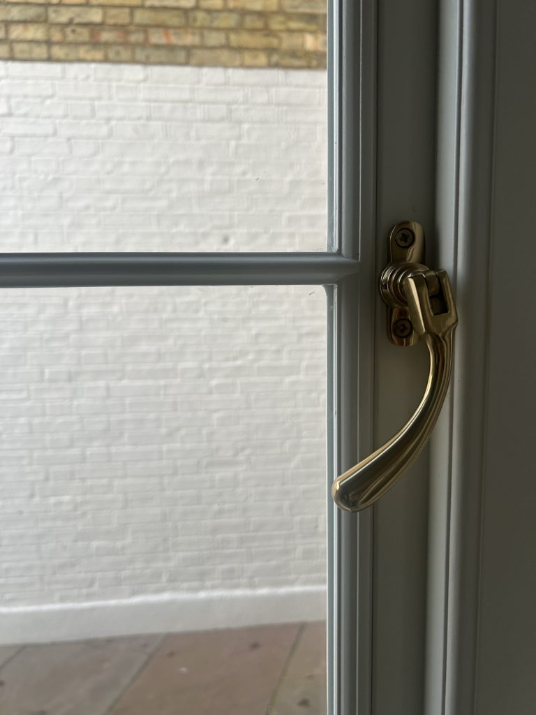 Close up of handle on timber casement window 