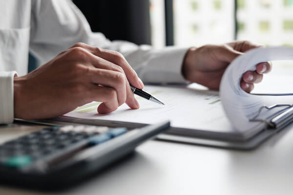 person looking through reports